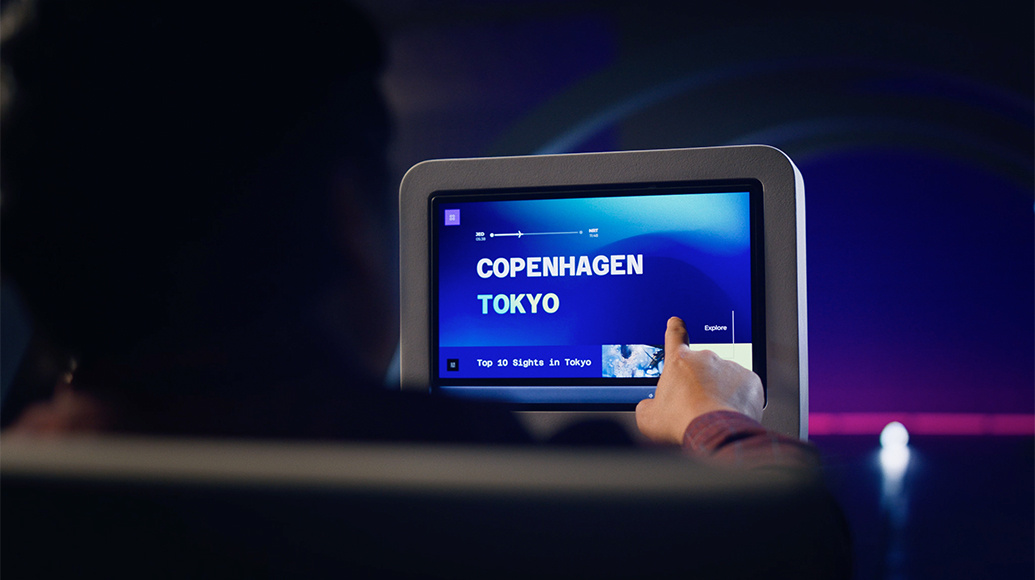 Astrova screen being used by a passenger with the destination Copenhagen, Tokyo on the screen display